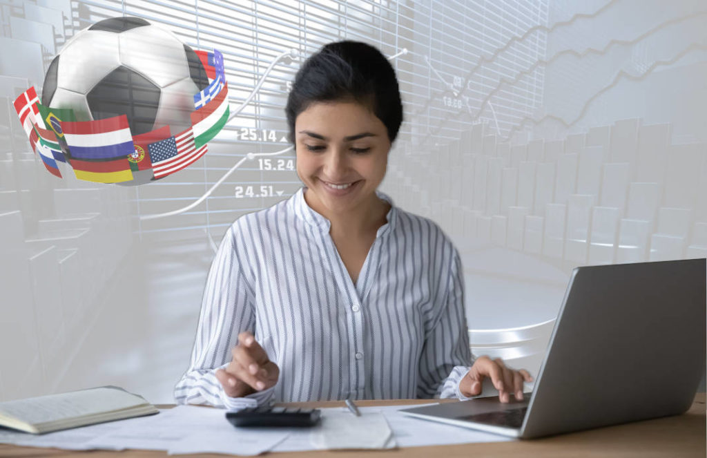 Smiling girl working on her laptop with a calculator, in the background graphs and a football with flags. A design to visually convey the idea of someone engaging in sports betting activities while maintaining their privacy.
