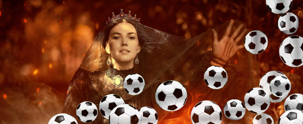 Soccerwidow doing magic with soccer balls: A beautiful sorceress queen in a black dress and with a black veil on her head surrounded by tongues of flame in a dark forest. Magic.