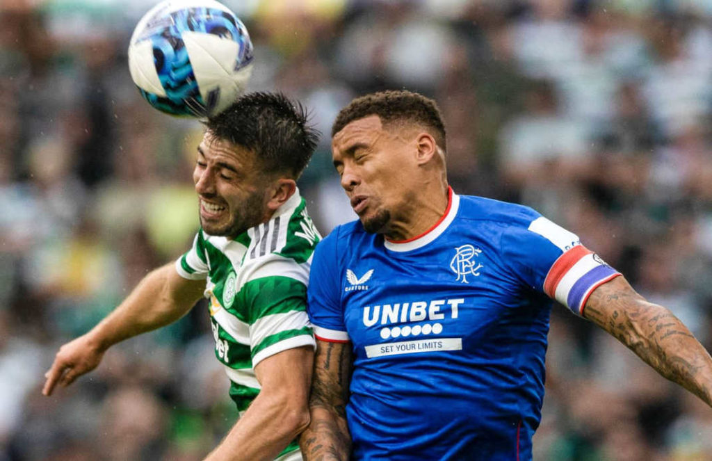 Scotland Premiership: Celtic vs Rangers match. Two players fighting for having a header. High concentration. Closeup shot.