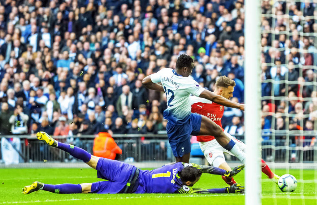 London, England - March 02 2019: Aaron Ramsey Arsenal FC scores his goal during the Premier League match between Tottenham Hotspur and Arsenal at Wembley Stadium